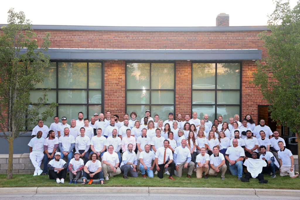 Employees of Premier Granite & Stone taking a group photo